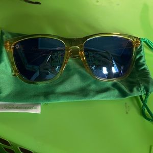 Yellow, transparent Knockaround sunglasses